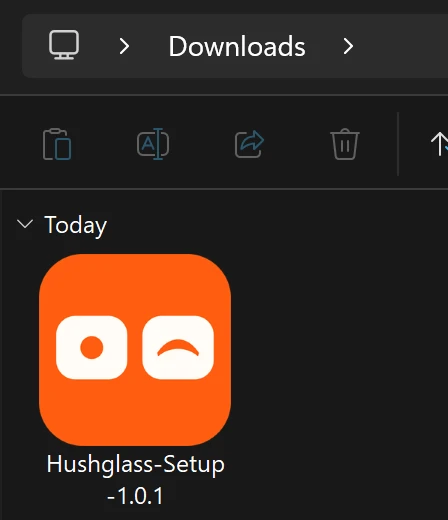The Downloads folder in File Explorer, showing the orange Hushglass-Setup-1.0.1 installer.